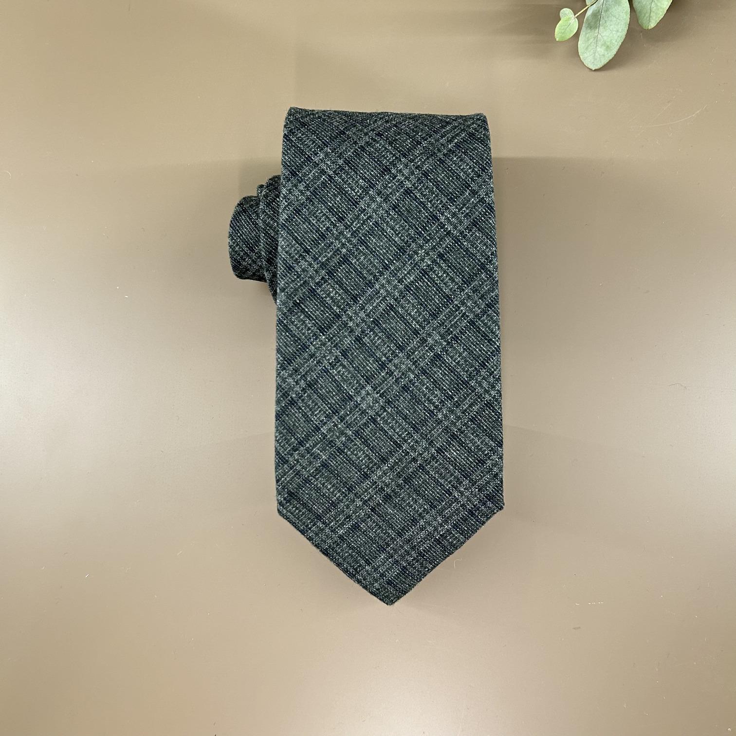 Greyish green tie in navy check