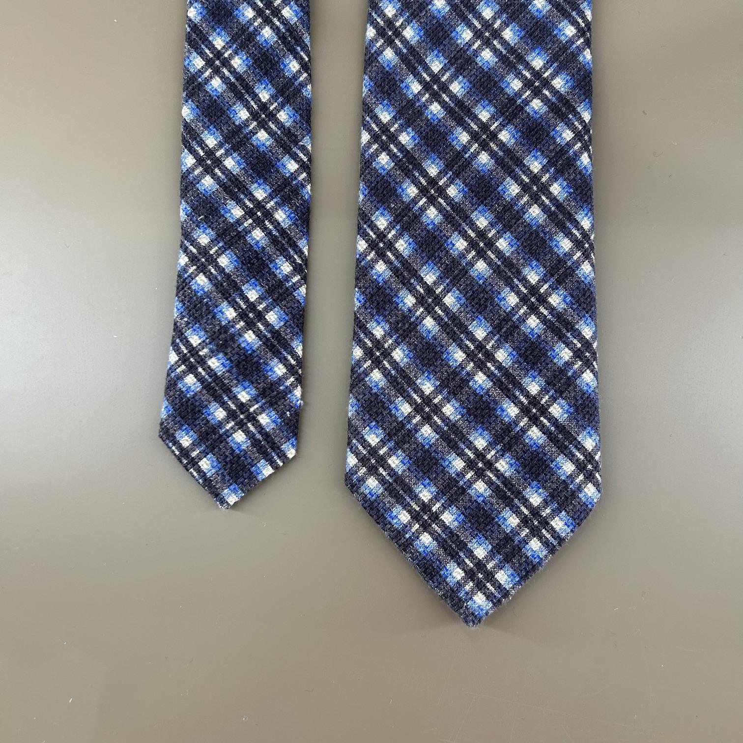 Blue wool tie with stripes and squares