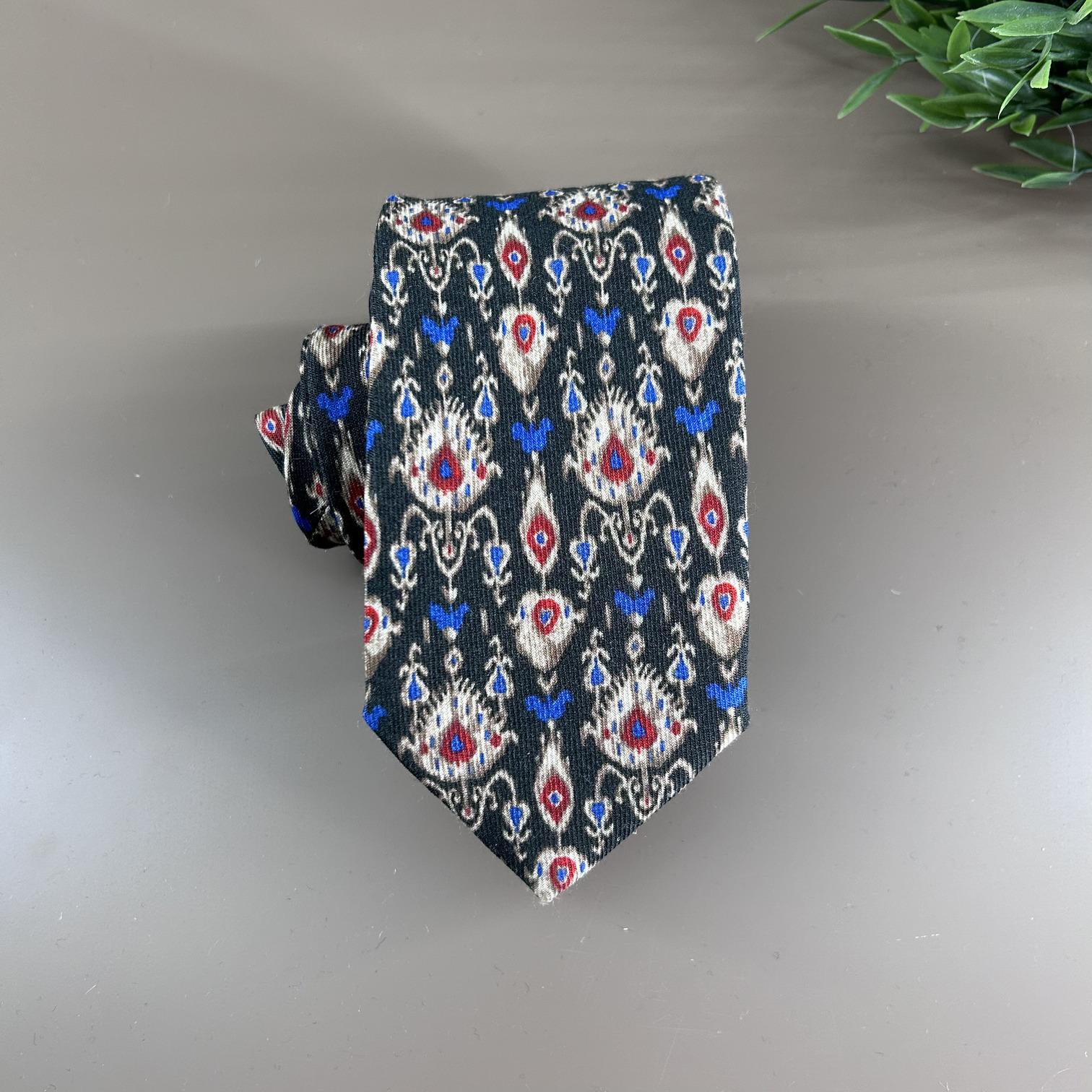 English green wool tie with vintage designs